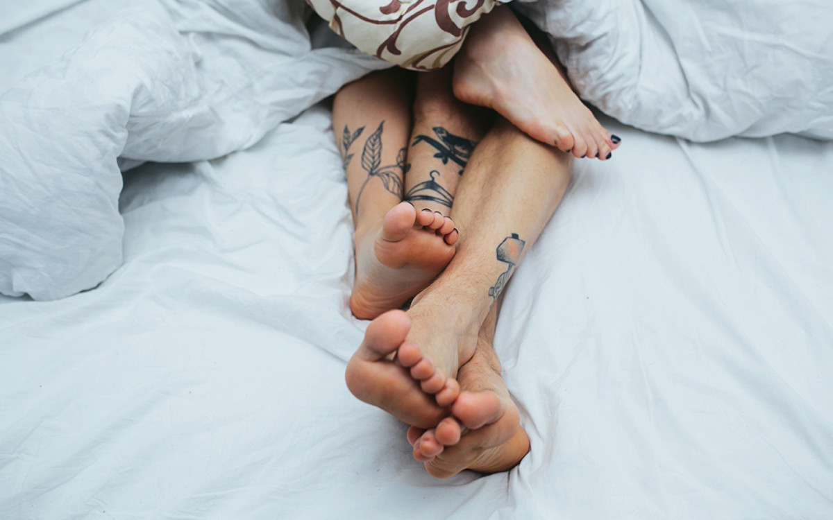 beautiful couple lying together on the bed