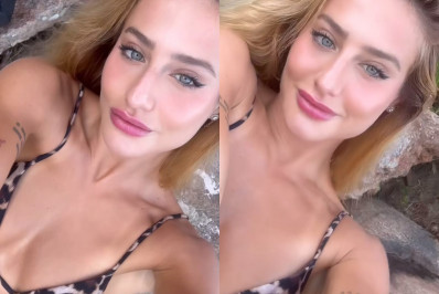 Bruna Griphao posa com biquíni de oncinha em praia