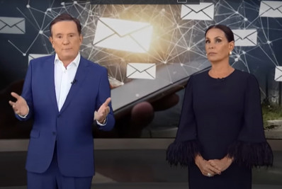 Vídeo! Roberto Cabrini puxa Carolina Ferraz pelo braço ao vivo e a corrige: 'Pode ler'
