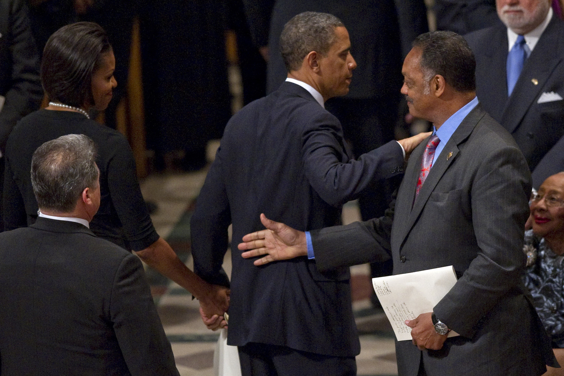 Ex-presidente dos EUA, Barack Obama, a ex-primeira-dama Michelle Obama e o reverendo Jesse Jackson - AFP
