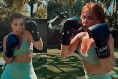 De top e short, Paolla Oliveira mostra habilidade em treino de boxe