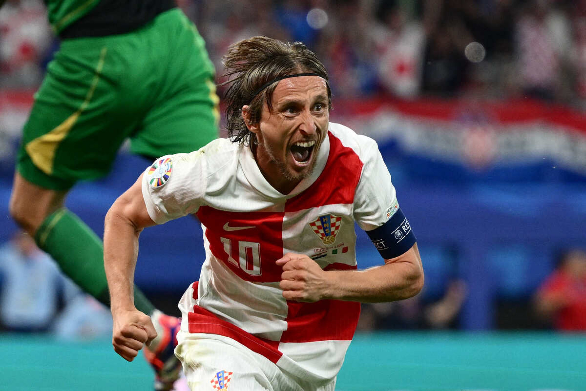 Croatia's midfielder #10 Luka Modric celebrates scoring his team's first goal during the UEFA Euro 2024 Group B football match between the Croatia and Italy at the Leipzig Stadium in Leipzig on June 24, 2024. (Photo by Christophe SIMON / AFP)