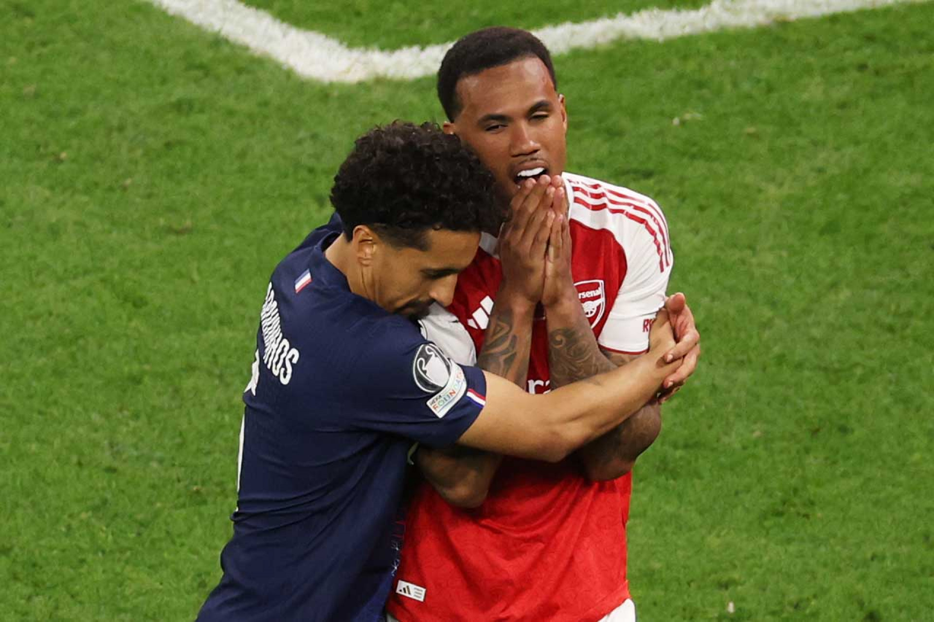 BUDAPEST, HUNGARY - MAY 30: Gabriel of Arsenal is hugged by Marquinhos of Paris Saint-Germain after missing the team's fifth penalty in the penalty shoot out during the UEFA Champions League Final 2026 match between Paris Saint-Germain and Arsenal FC at Puskas Arena on May 30, 2026 in Budapest, Hungary. (Photo by Richard Heathcote/Getty Images)