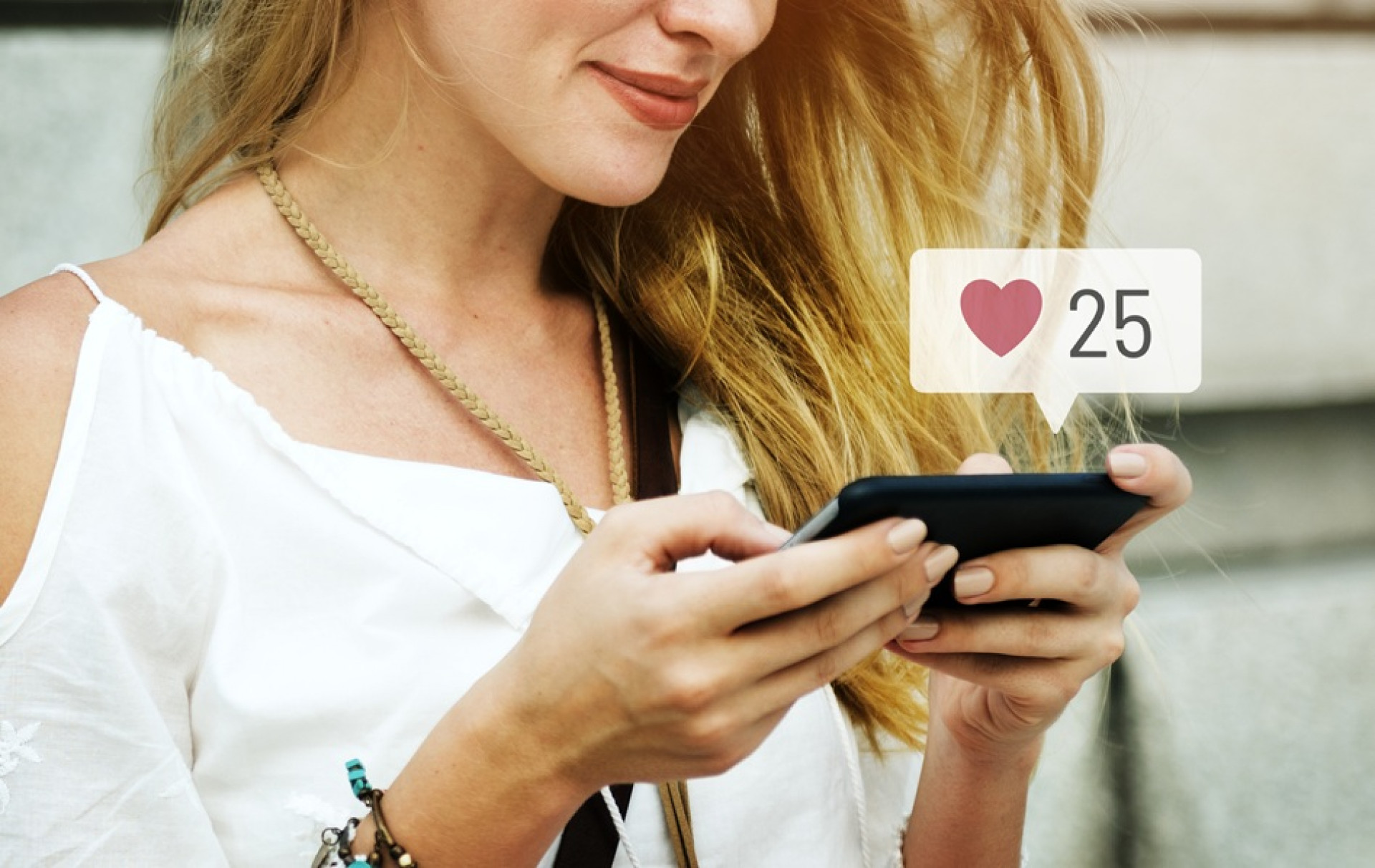 Happy woman using social media on her smartphone