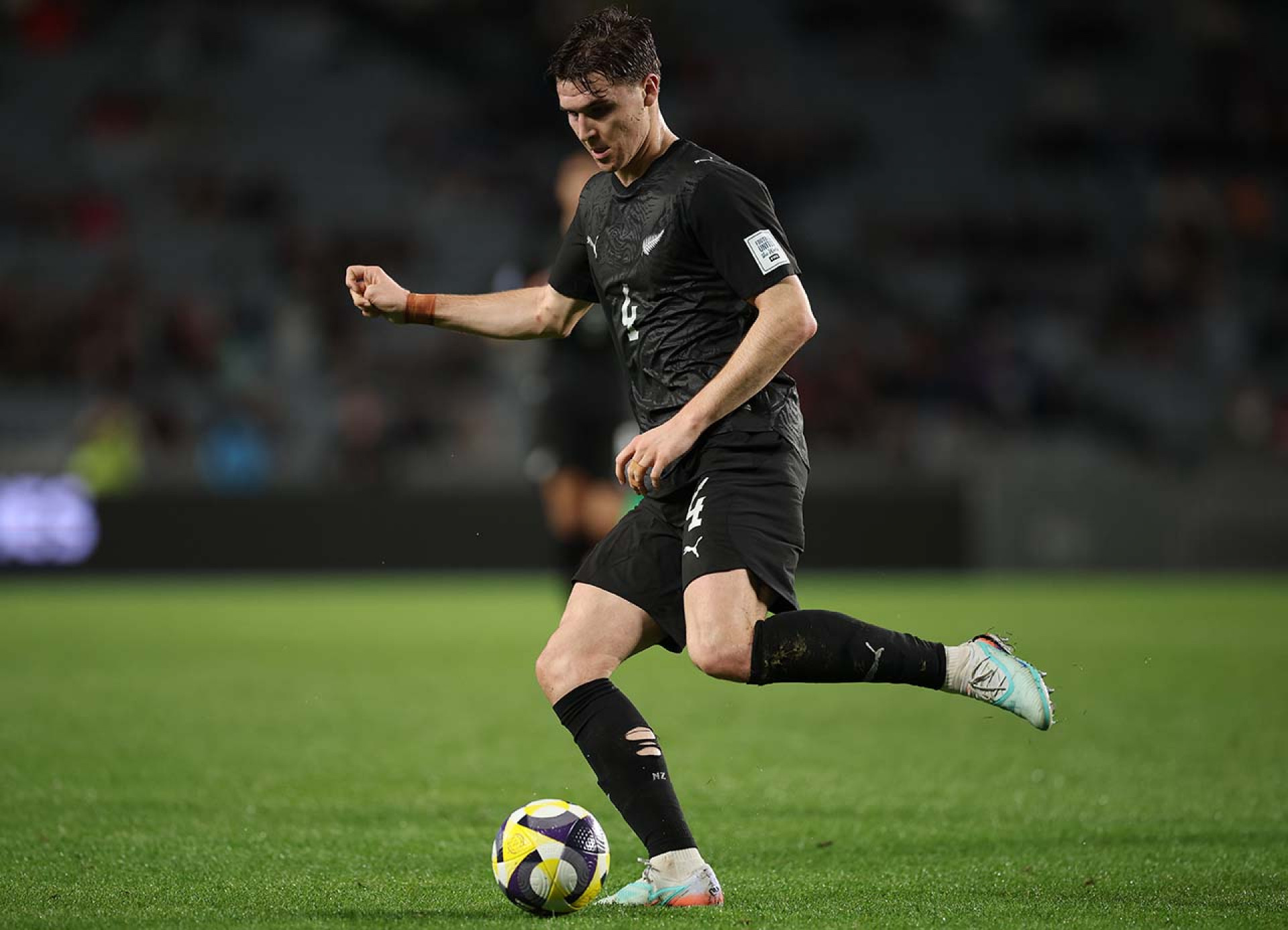 AUCKLAND, NEW ZEALAND - MARCH 30: Tyler Bindon of New Zealand kicks the ball during the FIFA Series match between New Zealand All Whites and Chile at Eden Park on March 30, 2026 in Auckland, New Zealand. (Photo by Phil Walter/Getty Images)