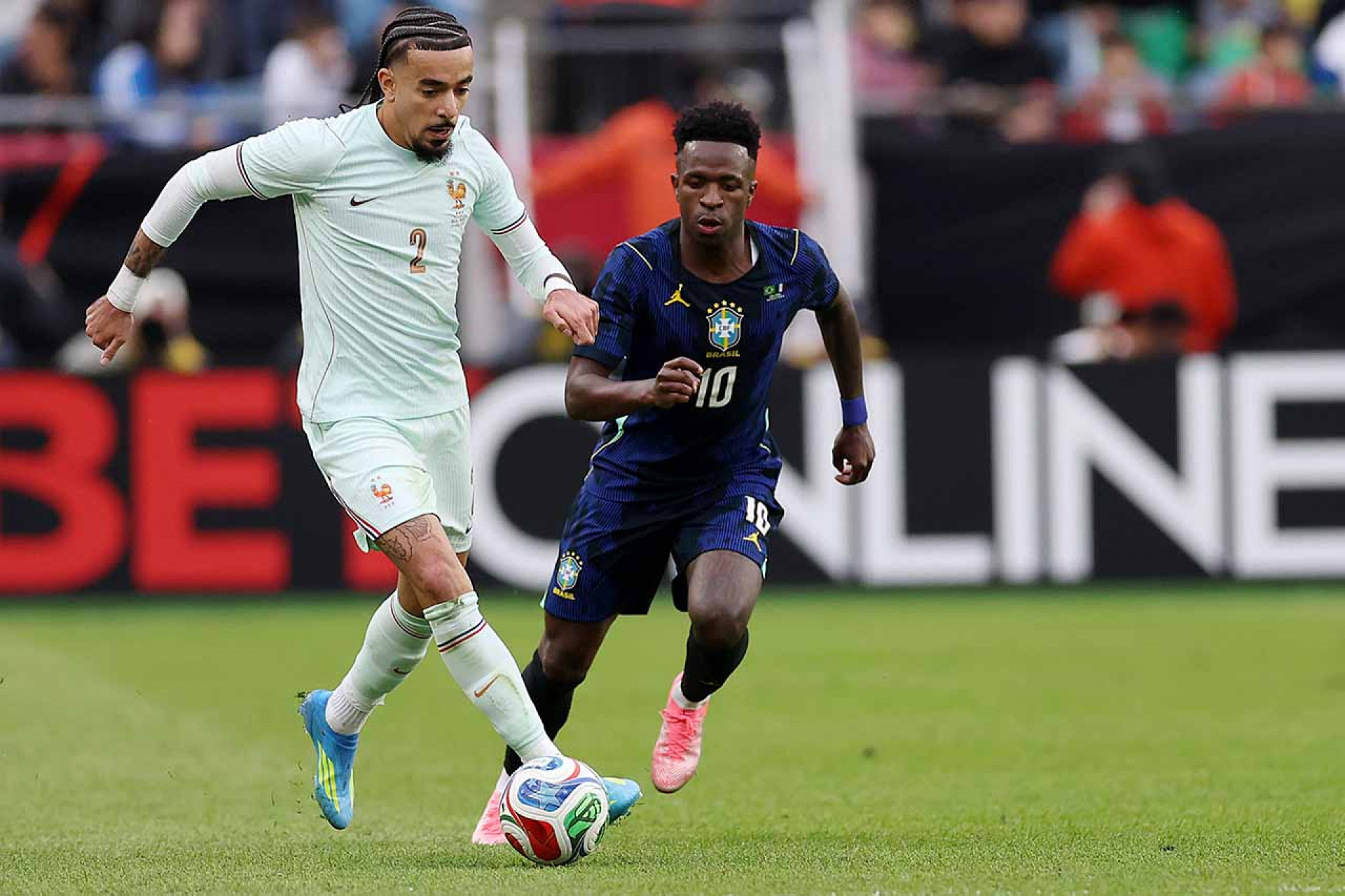 FOXBOROUGH, MASSACHUSETTS - MARCH 26: Malo Gusto #2 of France is challenged by b10the international friendly match between Brazil and France at Gillette Stadium on March 26, 2026 in Foxborough, Massachusetts. (Photo by Maddie Meyer/Getty Images)