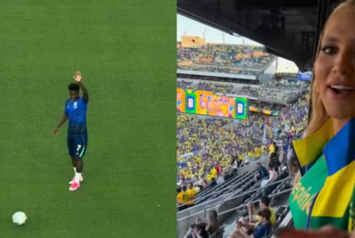 Vini Jr. acena para arquibancada onde estava Virginia Fonseca antes de jogo da Seleção