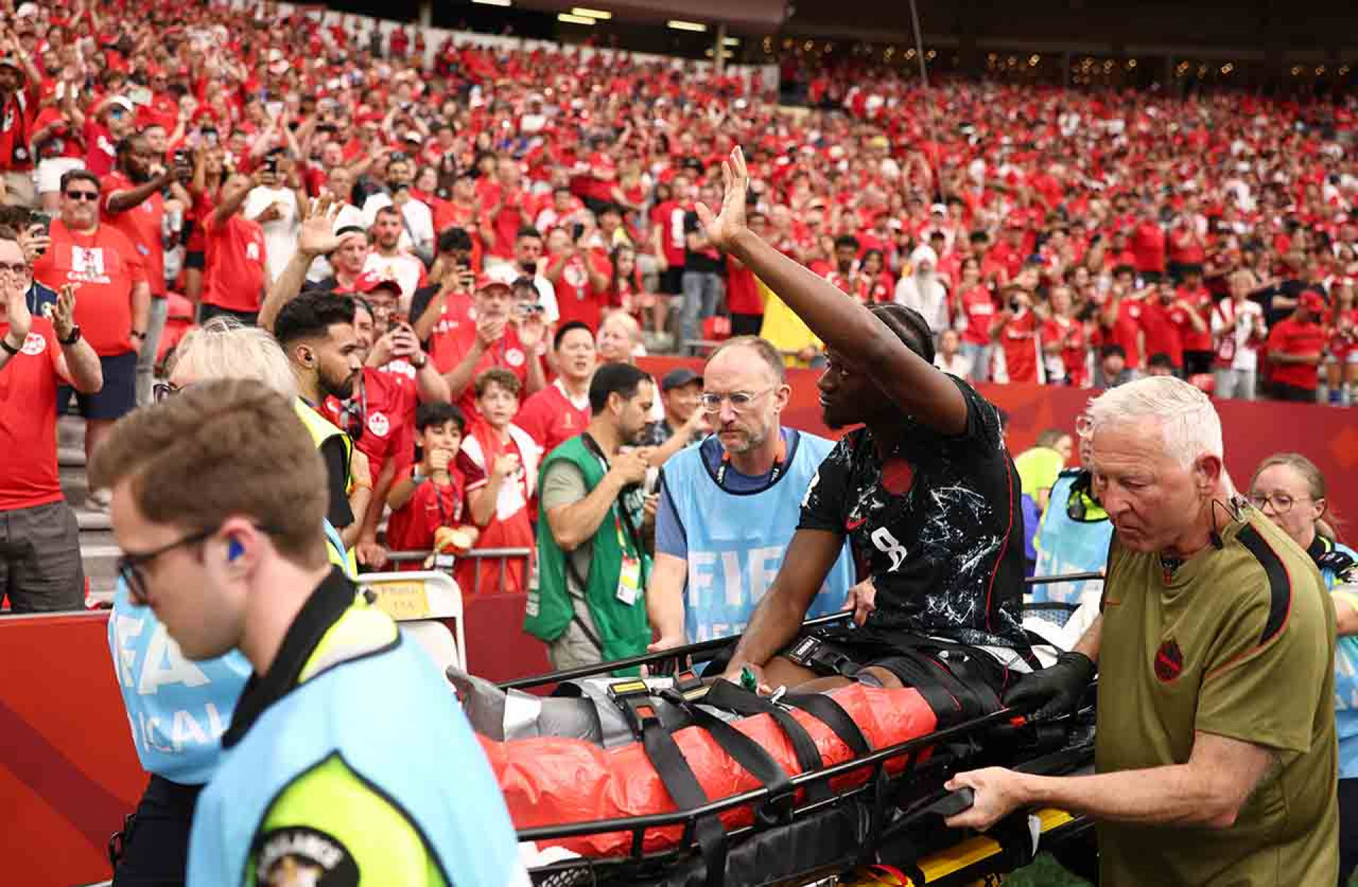 VANCOUVER, BRITISH COLUMBIA - JUNE 18: Ismael Kone #8 of Canada waves to crowd as he is stretched off after being fouled by Assim Madibo #23 of Qatar during the FIFA World Cup 2026 Group B match between Canada and Qatar at BC Place Vancouver on June 18, 2026 in Vancouver, British Columbia. (Photo by Fran Santiago/Getty Images)