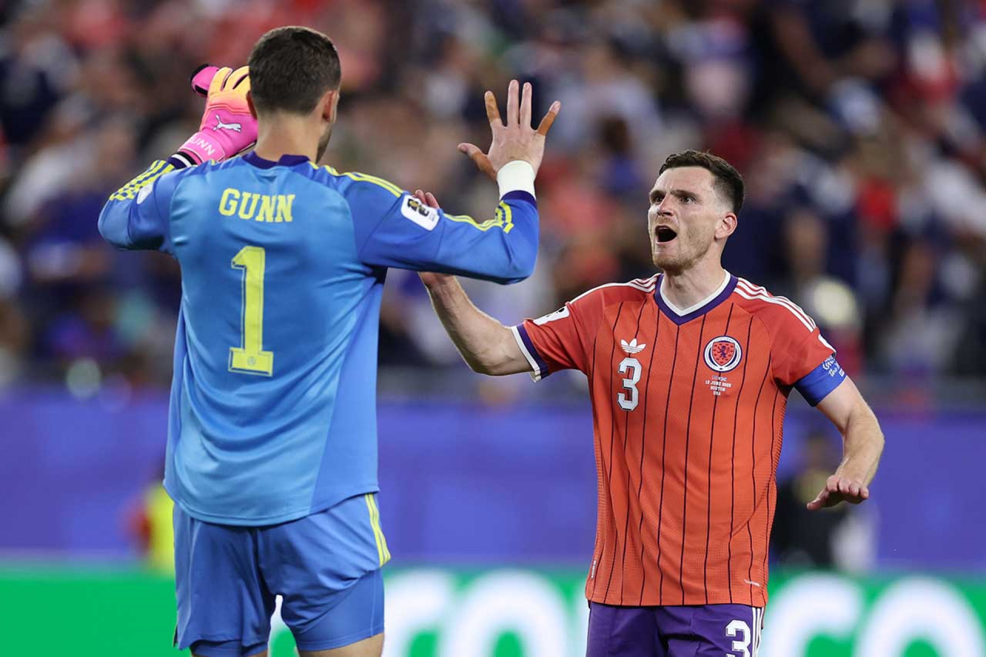 FOXBOROUGH, MASSACHUSETTS - JUNE 13: Angus Gunn #1 and Andy Robertson #3 of Scotland celebrate the team's 1-0 victory in the FIFA World Cup 2026 Group C match between Haiti and Scotland at Boston Stadium on June 13, 2026 in Foxborough, Massachusetts. (Photo by Justin Setterfield/Getty Images)