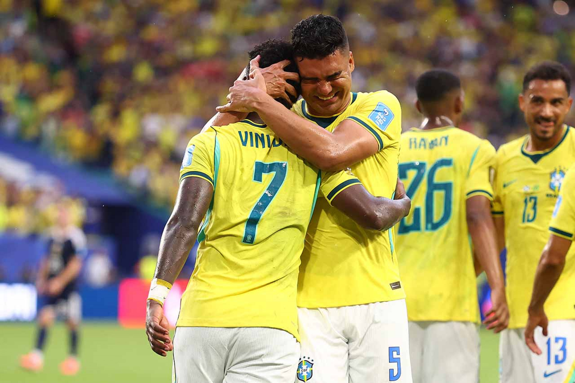 MIAMI GARDENS, FLORIDA - JUNE 24: Vinicius Junior #7 of Brazil celebrates with Casemiro #5 after scoring the team's second goal during the FIFA World Cup 2026 Group C match between Scotland and Brazil at Miami Stadium on June 24, 2026 in Miami Gardens, Florida. (Photo by Megan Briggs/Getty Images)