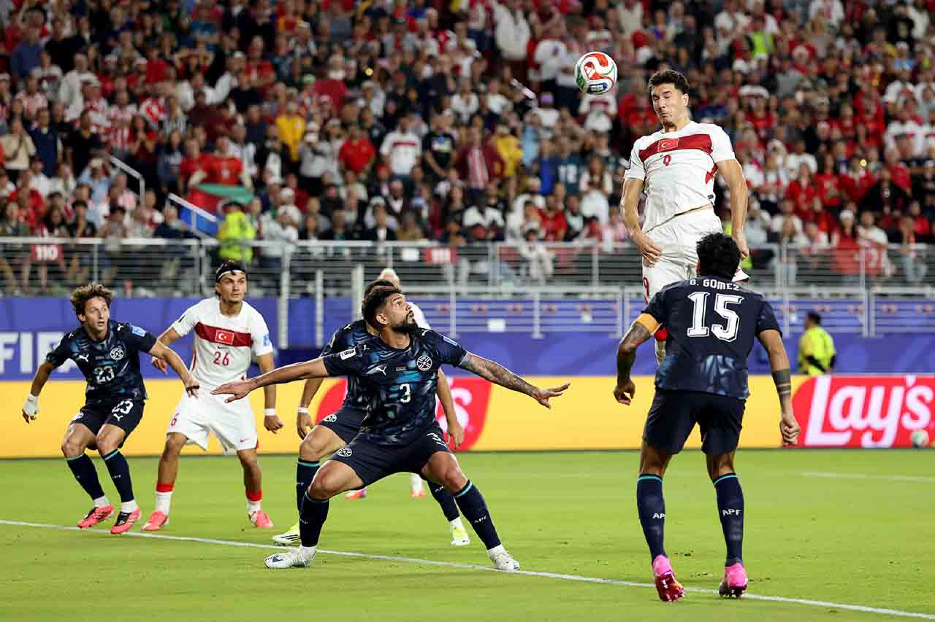 SANTA CLARA, CALIFORNIA - JUNE 19: Deniz Gul #9 of Turkiye attempts a header against Omar Alderete #3 of Paraguay during the FIFA World Cup 2026 Group D match between T&uuml;rkiye and Paraguay at San Francisco Bay Area Stadium on June 19, 2026 in Santa Clara, California. (Photo by Richard Heathcote/Getty Images)