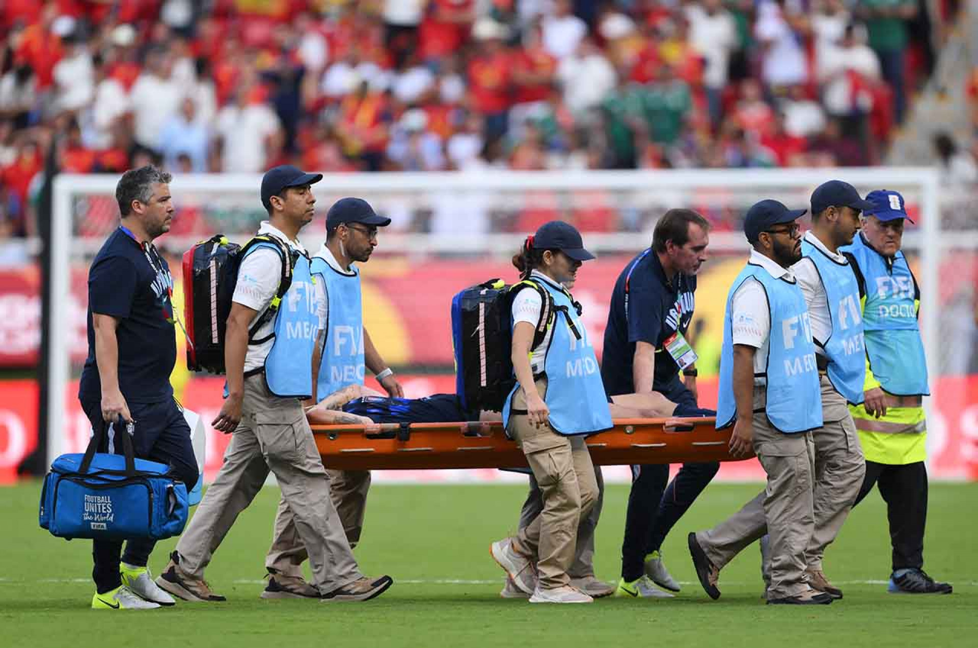 ZAPOPAN, MEXICO - JUNE 26: Manuel Ugarte #5 of Uruguay is stretched off after an injury during the FIFA World Cup 2026 Group H match between Uruguay and Spain at Guadalajara Stadium on June 26, 2026 in Zapopan, Mexico. (Photo by David Ramos/Getty Images)