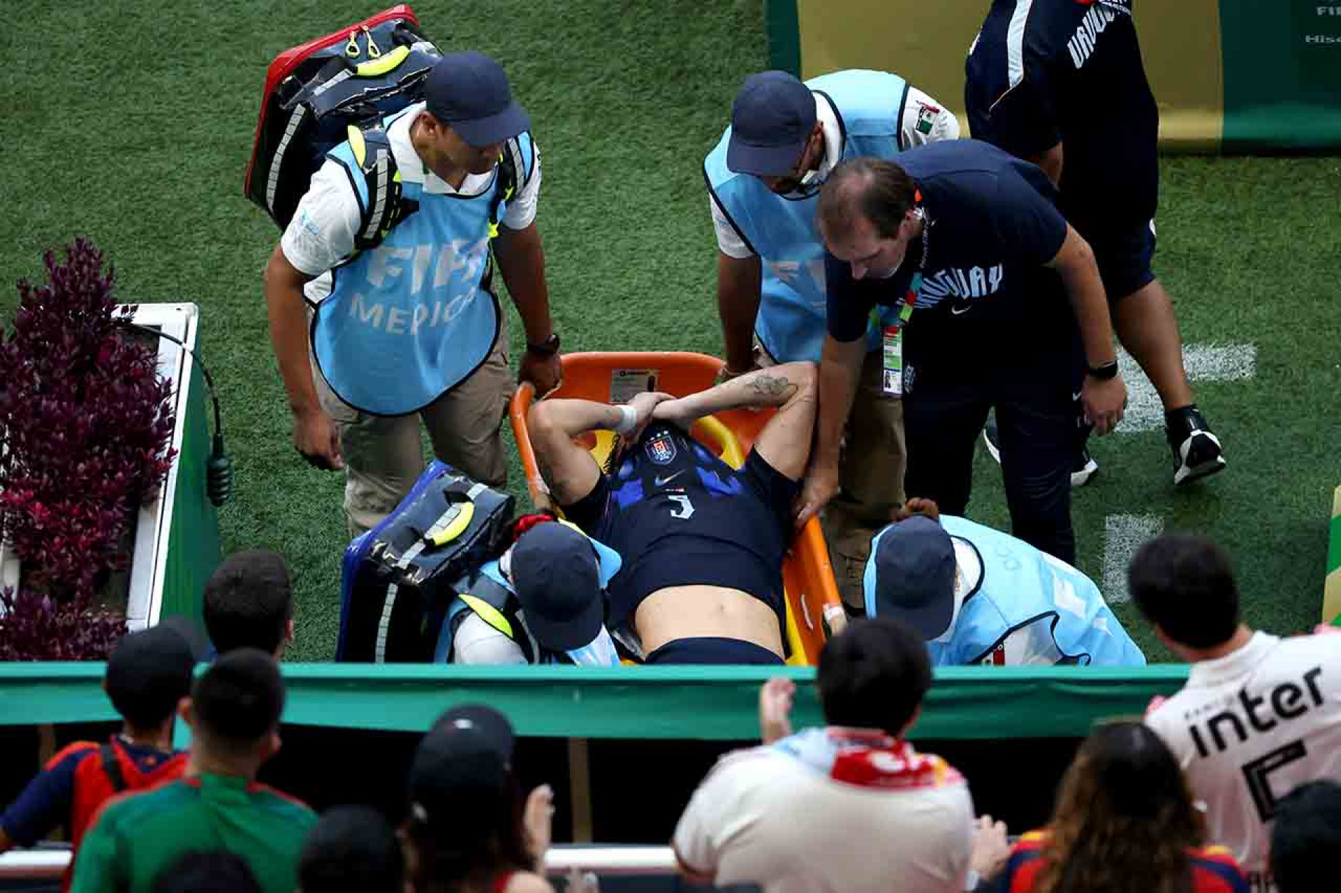 ZAPOPAN, MEXICO - JUNE 26: Manuel Ugarte #5 of Uruguay is stretched off after an injury during the FIFA World Cup 2026 Group H match between Uruguay and Spain at Guadalajara Stadium on June 26, 2026 in Zapopan, Mexico. (Photo by Luke Hales/Getty Images)