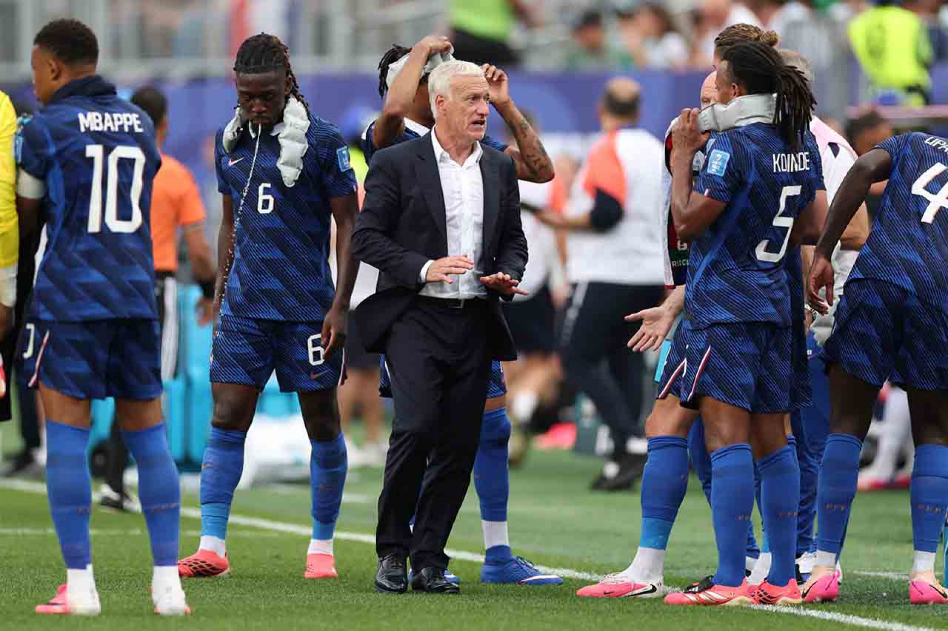 PHILADELPHIA, PENNSYLVANIA - JUNE 22: Didier Deschamps, Head Coach of France, speaks with his players during the hydration break during the FIFA World Cup 2026 Group I match between France and Iraq at Philadelphia Stadium on June 22, 2026 in Philadelphia, Pennsylvania. (Photo by Dan Mullan/Getty Images)