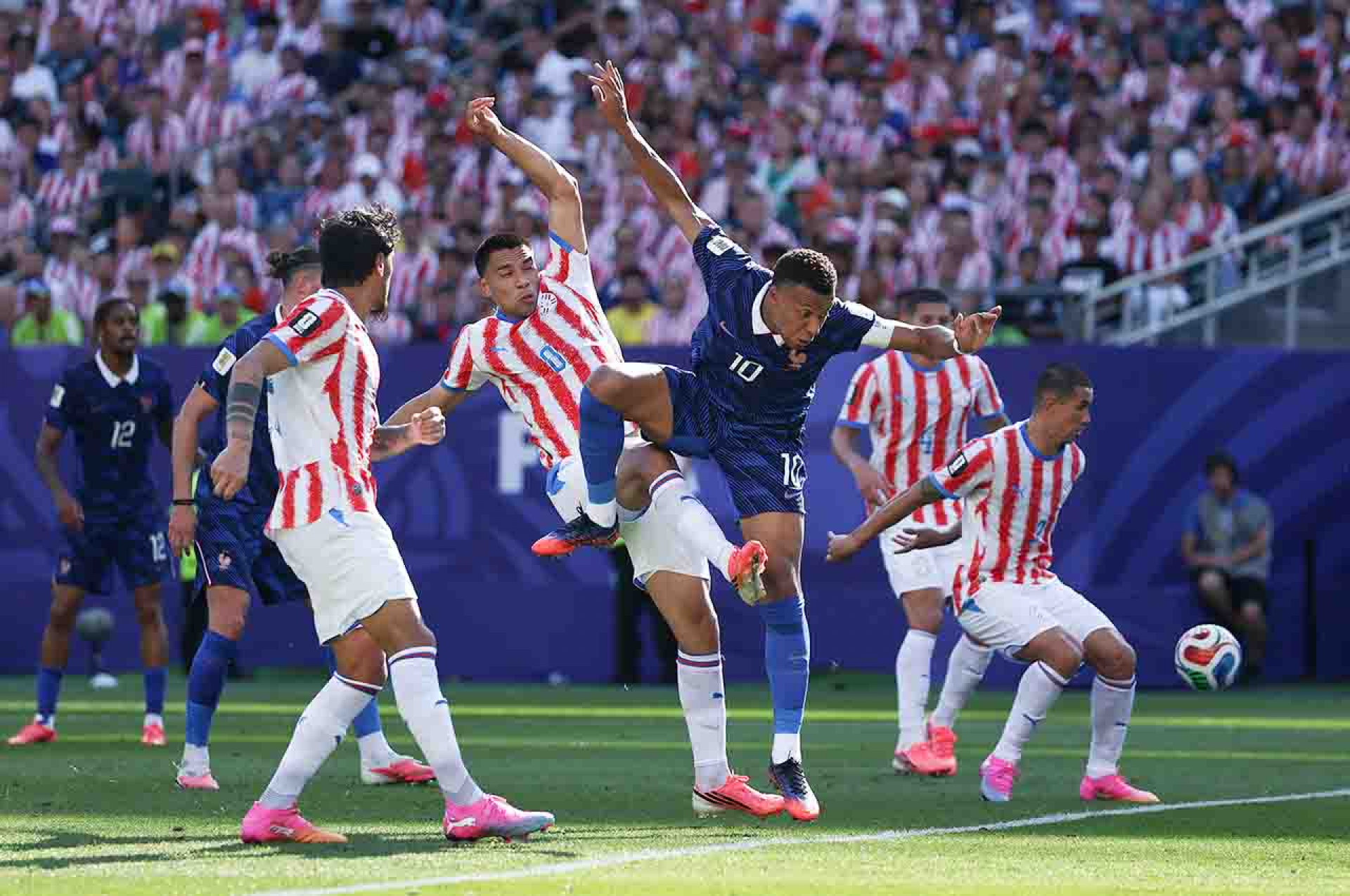 PHILADELPHIA, PENNSYLVANIA - JULY 04: Kylian Mbappe #10 of France competes for the ball against Diego Gomez #8 of Paraguay during the FIFA World Cup 2026 Round of 16 match between Paraguay and France at Philadelphia Stadium on July 04, 2026 in Philadelphia, Pennsylvania. (Photo by Buda Mendes/Getty Images)
