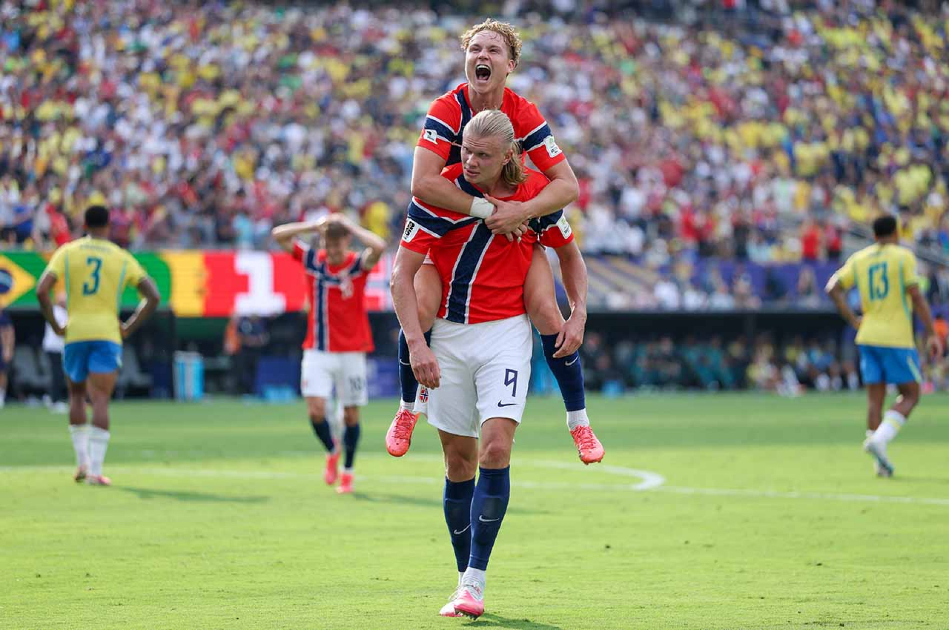 EAST RUTHERFORD, NEW JERSEY - JULY 05: Erling Haaland #9 of Norway celebrates with teammate Andreas Schjelderup #21 after scoring his team's second goal during the FIFA World Cup 2026 Round of 16 match between Brazil and Norway at New York New Jersey Stadium on July 05, 2026 in East Rutherford, New Jersey. (Photo by Al Bello/Getty Images)