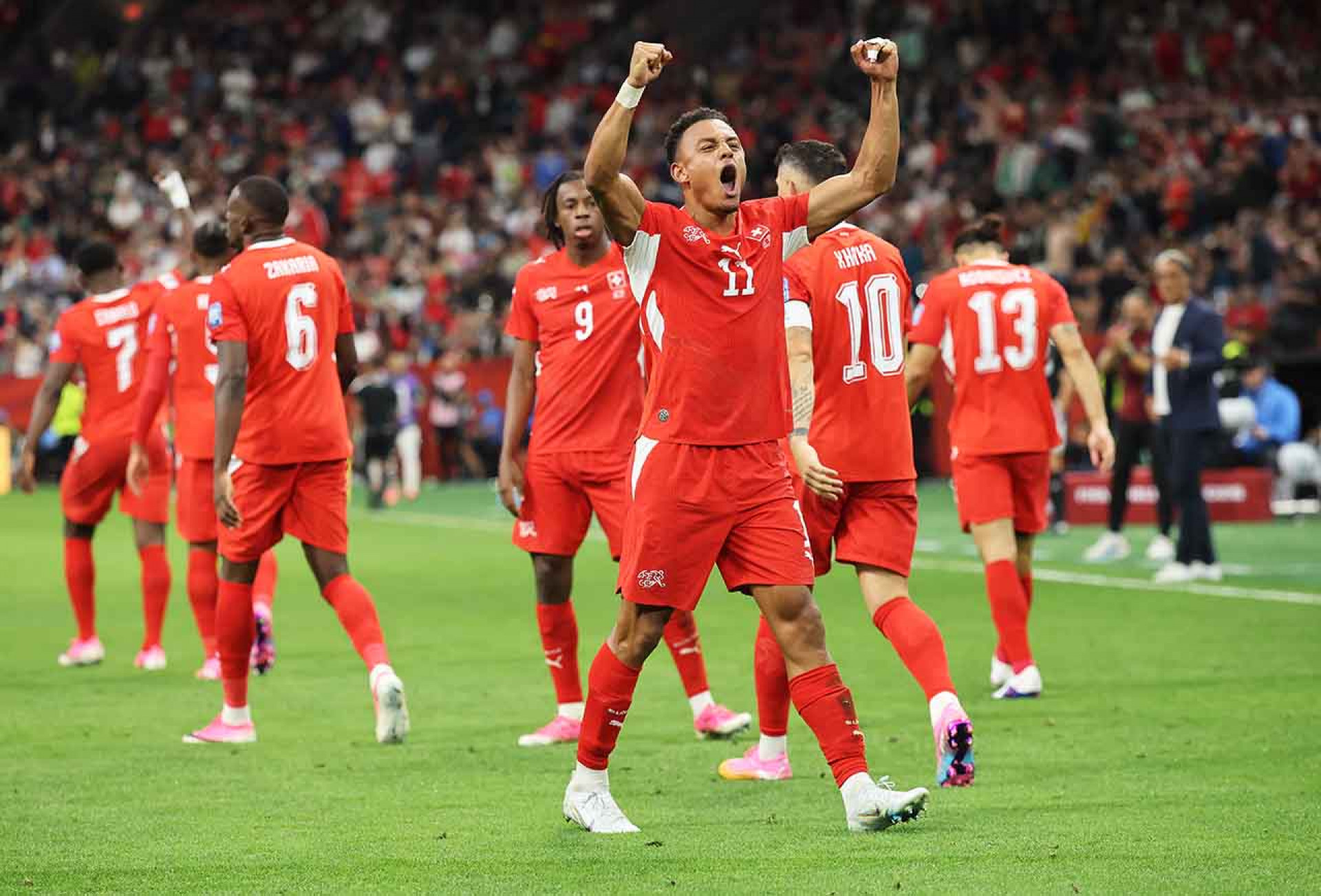 VANCOUVER, BRITISH COLUMBIA - JULY 02: Dan Ndoye #11 of Switzerland celebrates scoring his team's second goal during the FIFA World Cup 2026 Round of 32 match between Switzerland and Algeria at BC Place Vancouver on July 02, 2026 in Vancouver, British Columbia. (Photo by Alex Grimm/Getty Images)