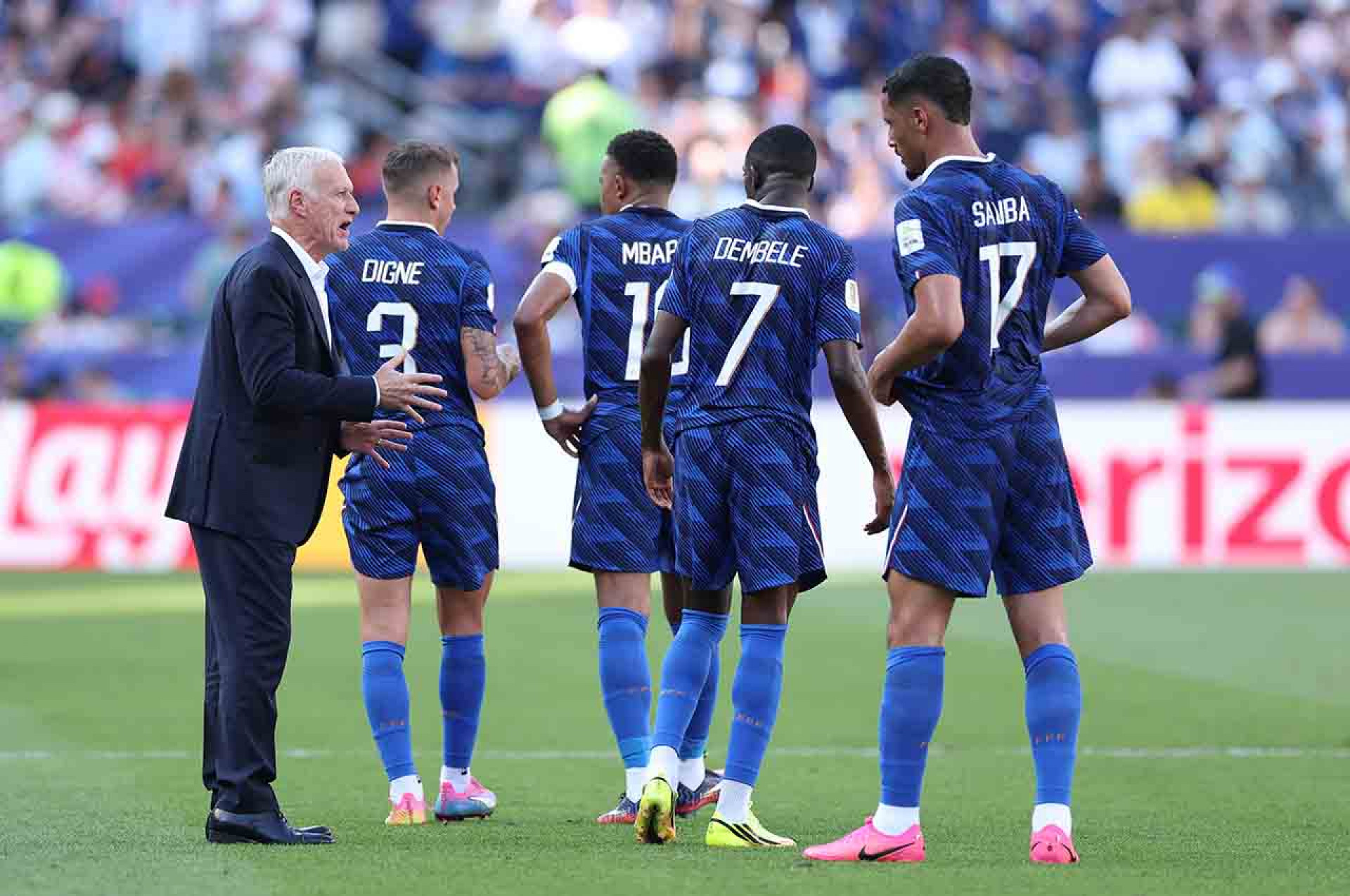 PHILADELPHIA, PENNSYLVANIA - JULY 04: Didier Deschamps, Head Coach of France, speaks with his players during a hydration break in the FIFA World Cup 2026 Round of 16 match between Paraguay and France at Philadelphia Stadium on July 04, 2026 in Philadelphia, Pennsylvania. (Photo by Dan Mullan/Getty Images)