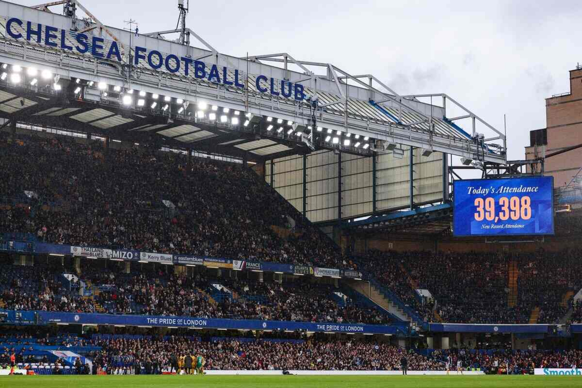 A giant screen indicates the number of people attending the UEFA Women's Champions League semi-final second leg football match between Chelsea and Barcelona at Stamford Bridge, in London, on April 27, 2024. (Photo by Adrian DENNIS / AFP)